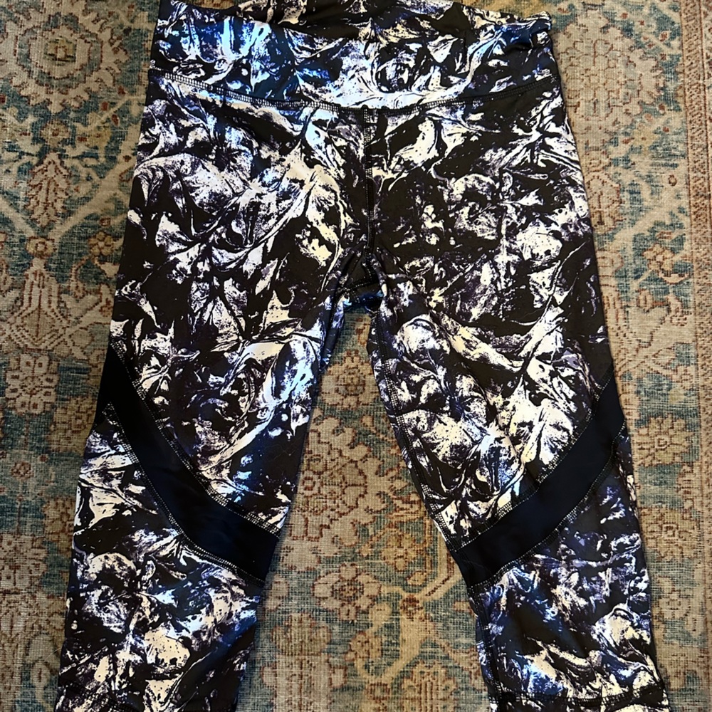 Noli size medium capris in black, white and purple.